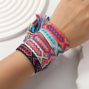 Friendship bracelets with colorful tassels in ethnic style